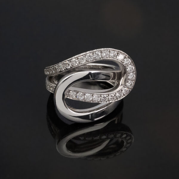 4500 Interwoven diamond loop ring in 18K white gold with one polished band and one pavé-set with brilliant-cut diamonds by Claris-A.