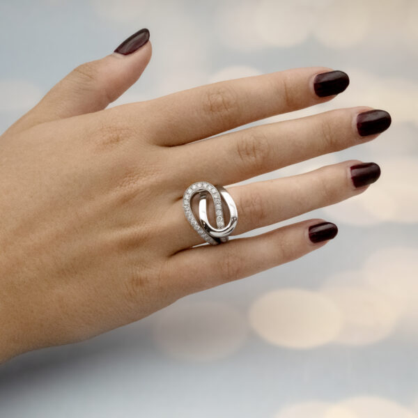 interwoven-diamond-loop-ring-claris-a.jpg Interwoven diamond loop ring in 18K white gold with one polished band and one pavé-set with brilliant-cut diamonds by Claris-A.