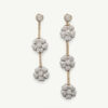 Cover-Clairs-A-Diamond-Folwer-Earrings Diamond floral drop earrings in 18K white and yellow gold with asymmetric flower clusters and slender connecting lines by Claris-A.