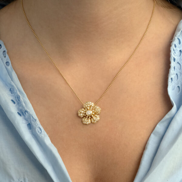 diamond-flower-pendant-necklace-claris-a.jpg Diamond flower pendant necklace in 18K yellow gold with pavé-set petals and a bezel-set center diamond by Claris-A.