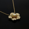 diamond-flower-pendant-necklace-claris-a.jpg Diamond flower pendant necklace in 18K yellow gold with pavé-set petals and a bezel-set center diamond by Claris-A.