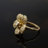 Diamond flower ring in 18K yellow gold with individually shaped diamond-set petals and a 0.15 ct center diamond by Claris-A.