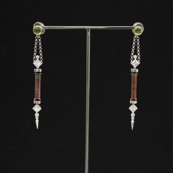 5021 White gold earrings with vertically set green-to-pink bicolor tourmalines framed by diamonds and suspended from chain links.