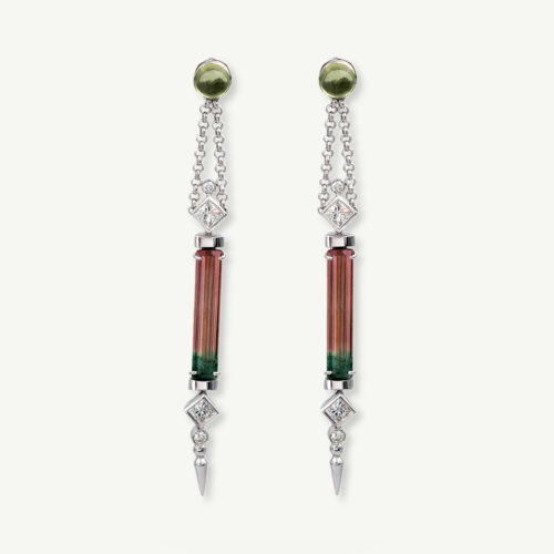Cover_ClarisA_Watermelon_Tourmaline White gold earrings with vertically set green-to-pink bicolor tourmalines framed by diamonds and suspended from chain links.