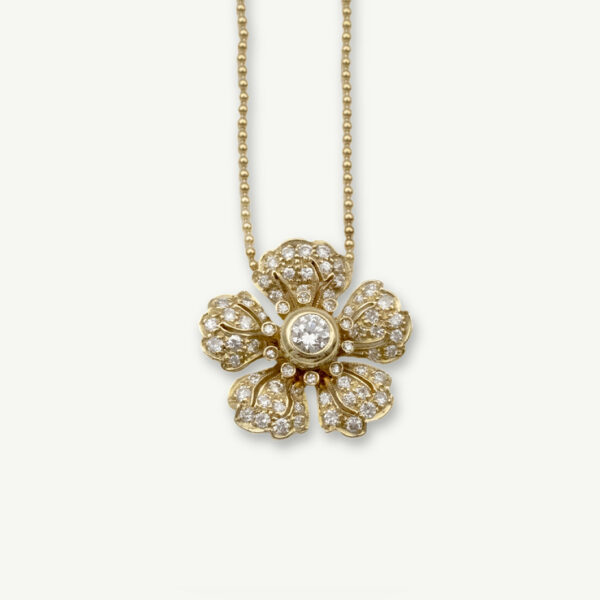 diamond-flower-pendant-necklace-claris-a.jpg Diamond flower pendant necklace in 18K yellow gold with pavé-set petals and a bezel-set center diamond by Claris-A.