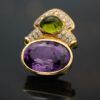 Amethyst, peridot, and diamond earrings in 18K yellow gold with oval-cut amethysts, cabochon peridots, and pavé-set diamonds in refined Italian design by Claris-A.