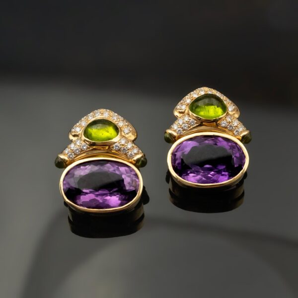 Amethyst, peridot, and diamond earrings in 18K yellow gold with oval-cut amethysts, cabochon peridots, and pavé-set diamonds in refined Italian design by Claris-A.