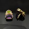 Amethyst, peridot, and diamond earrings in 18K yellow gold with oval-cut amethysts, cabochon peridots, and pavé-set diamonds in refined Italian design by Claris-A.