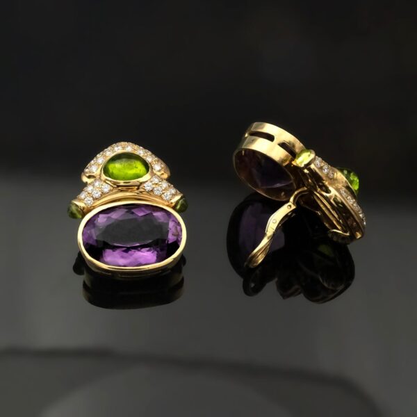 Amethyst, peridot, and diamond earrings in 18K yellow gold with oval-cut amethysts, cabochon peridots, and pavé-set diamonds in refined Italian design by Claris-A.