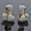 diamond-ribbon-earrings-claris-a.jpg Diamond ribbon earrings in 18K yellow gold shaped as sculpted bows pavé-set with brilliant-cut diamonds by Claris-A.