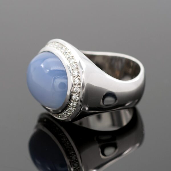Chalcedony and diamond ring in 18K white gold with a domed lavender-blue chalcedony cabochon framed by brilliant-cut diamonds by Claris-A.