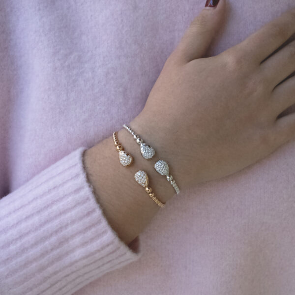 diamond-cuff-bracelet-18k-rose-gold.jpg 18K rose gold diamond cuff bracelet with articulated bead structure and teardrop diamond caps