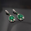 muzo-green-colombian-emerald-diamond-earrings-white-gold.jpg Muzo green Colombian emerald diamond earrings in 18K white gold with pear-shaped emeralds framed by emeralds and diamonds