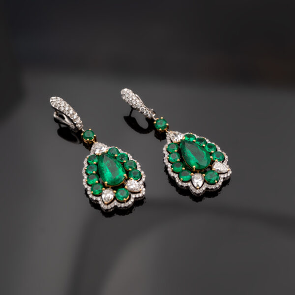 Muzo green Colombian emerald diamond earrings in 18K white gold with pear-shaped emeralds framed by emeralds and diamonds