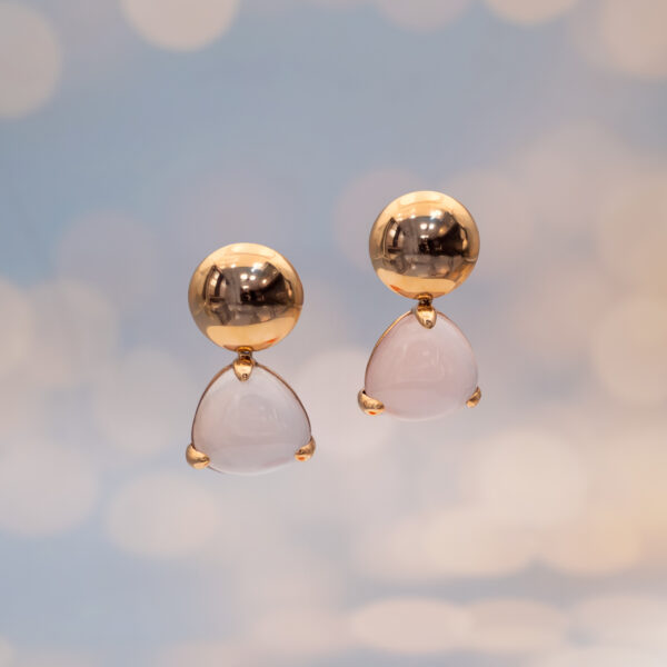Rose gold earrings with a softly translucent triangular rose quartz cabochon drop, featuring a rounded element at the ear and smooth mounts.