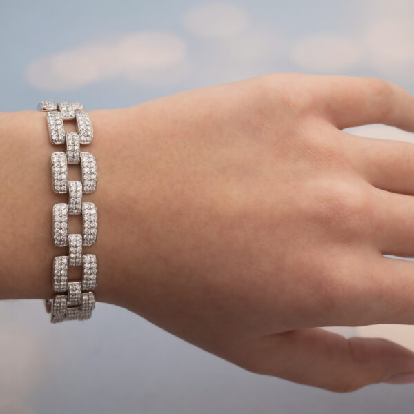 Diamond Panel Bracelet in 18K White Gold Articulated 18K white gold bracelet composed of rectangular diamond-set links with open centres and a graphic, structured design.