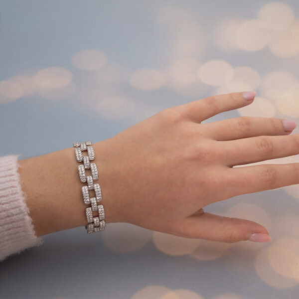 Diamond Panel Bracelet in 18K White Gold Articulated 18K white gold bracelet composed of rectangular diamond-set links with open centres and a graphic, structured design.