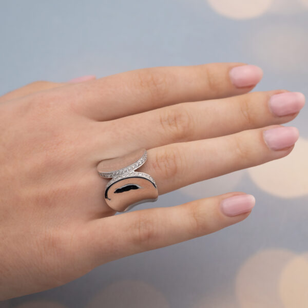 ClarisA_PaveRing_WhiteGold Contemporary 18K white gold ring with pavé-set diamonds, sculptural curved design