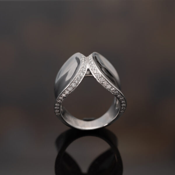 Contemporary White Gold Diamond Ring – Sculptural Curve Contemporary 18K white gold ring with pavé-set diamonds, sculptural curved design