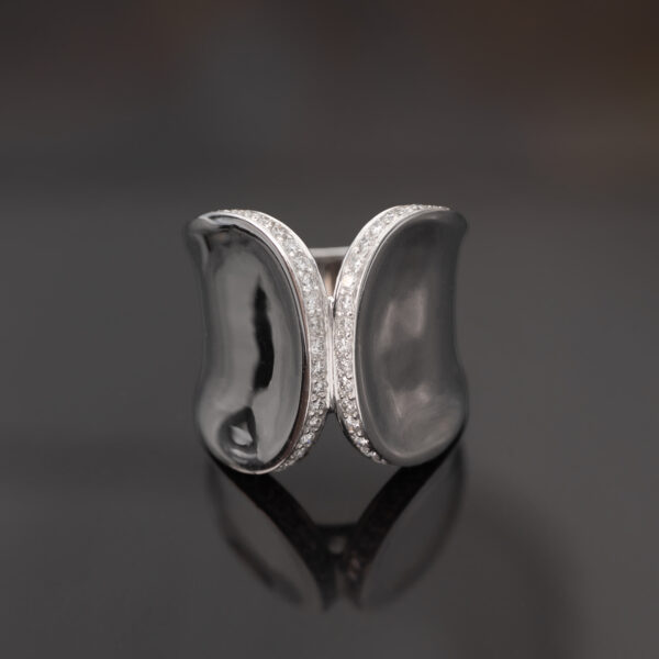 Contemporary White Gold Diamond Ring – Sculptural Curve Contemporary 18K white gold ring with pavé-set diamonds, sculptural curved design
