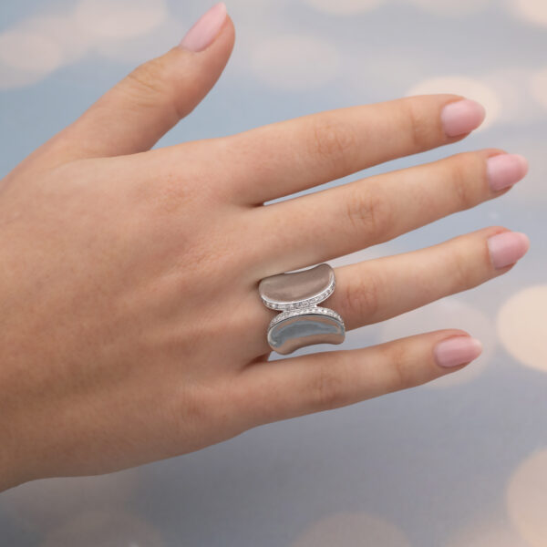 Contemporary White Gold Diamond Ring – Sculptural Curve Contemporary 18K white gold ring with pavé-set diamonds, sculptural curved design