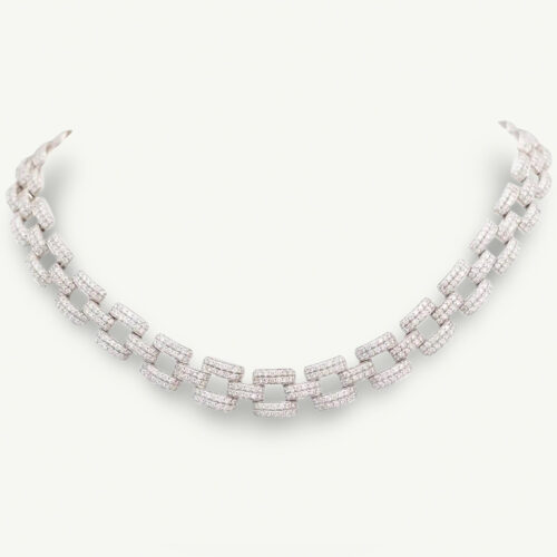 Cover_Necklace_ClarisA_WhiteGold Articulated 18K white gold necklace composed of rectangular diamond-set links with open centres and a structured, graphic design.