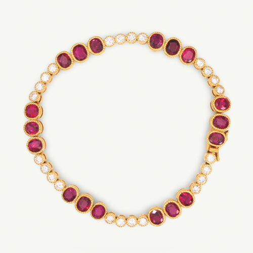 Articulated 18K yellow gold link bracelet set with rubies and diamonds, featuring sculptural geometric links arranged in a fluid line.