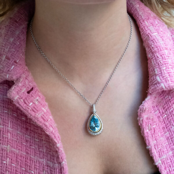 Aquamarine Diamond Halo Pendant White Yellow Gold White and yellow gold pendant with pear-shaped aquamarine and diamond halo