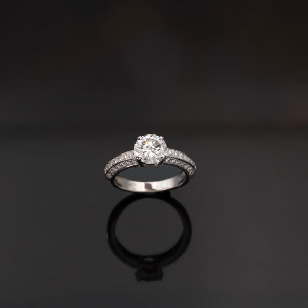 5997 18K white gold diamond engagement ring with a 1.50ct round brilliant centre stone in a four-prong setting and pavé-set diamond