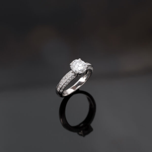 5998 18K white gold diamond engagement ring with a 1.50ct round brilliant centre stone in a four-prong setting and pavé-set diamond