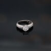 6002 copie 18K white gold diamond engagement ring with a 1.50ct round brilliant centre stone in a four-prong setting and pavé-set diamond