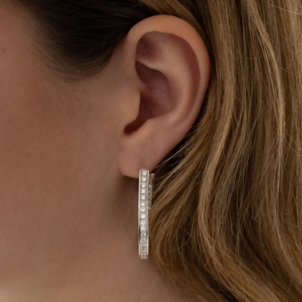 Diamond Oval Hoop Earrings White Gold White gold oval hoop earrings with brilliant-cut diamonds in a single row