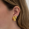 on-ear Ruby Diamond Shell Earrings Yellow Gold Yellow gold ribbed shell earrings with cabochon rubies and diamond accents