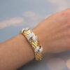 6555 Wide ribbed yellow and white gold bracelet with diamond-set teardrop motifs