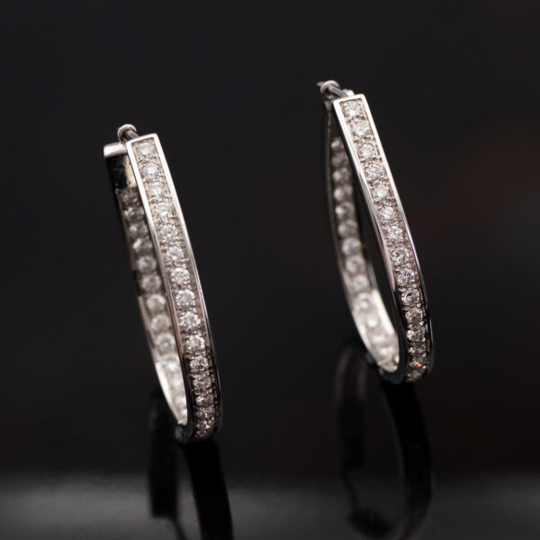 Diamond Oval Hoop Earrings White Gold White gold oval hoop earrings with brilliant-cut diamonds in a single row