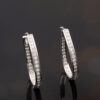 Diamond Oval Hoop Earrings White Gold White gold oval hoop earrings with brilliant-cut diamonds in a single row