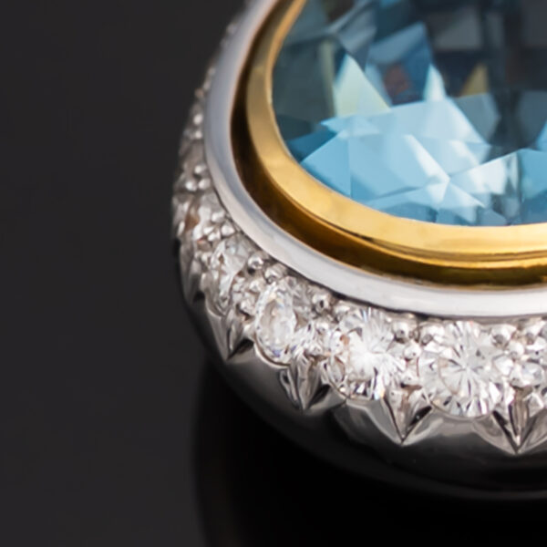 White and yellow gold pendant with pear-shaped aquamarine and diamond halo