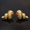 Ruby Diamond Shell Earrings Yellow Gold Yellow gold ribbed shell earrings with cabochon rubies and diamond accents