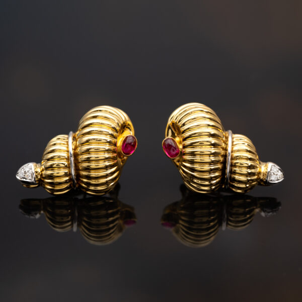 Ruby Diamond Shell Earrings Yellow Gold Yellow gold ribbed shell earrings with cabochon rubies and diamond accents