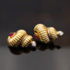 Ruby Diamond Shell Earrings Yellow Gold Yellow gold ribbed shell earrings with cabochon rubies and diamond accents