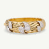 COVER WEBSITE CLARIS A Wide ribbed yellow and white gold bracelet with diamond-set teardrop motifs