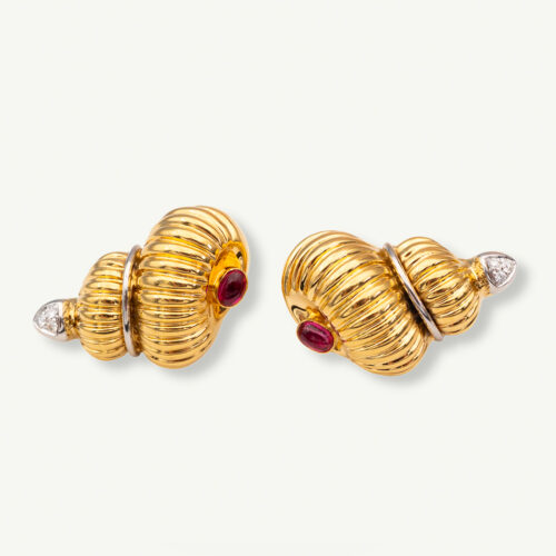 Cover_ClarisA_ShellEarrings Yellow gold ribbed shell earrings with cabochon rubies and diamond accents