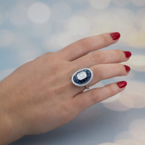 Sapphire Diamond Illusion Cluster Ring 18K white gold ring with illusion-set diamond cluster centre surrounded by baguette sapphires and pavé diamonds