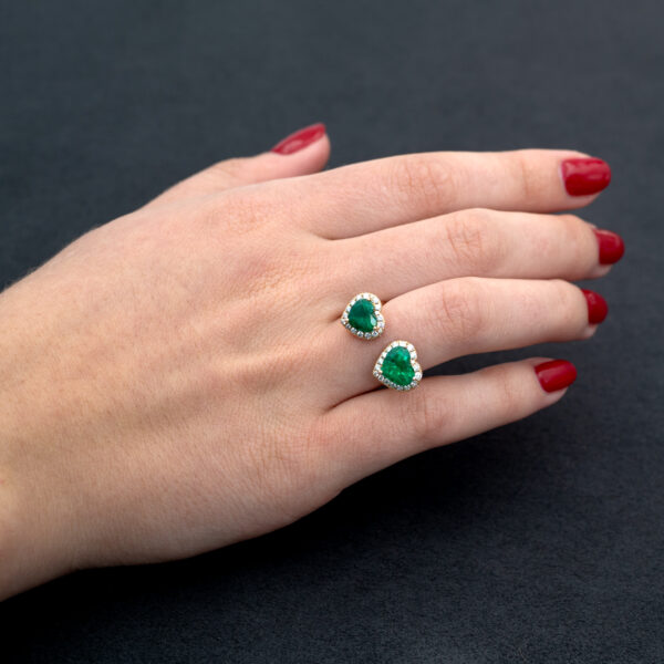 Emerald Toi et Moi Ring in Rose Gold Rose gold toi et moi ring with two heart-shaped Colombian emeralds and diamond halo settings