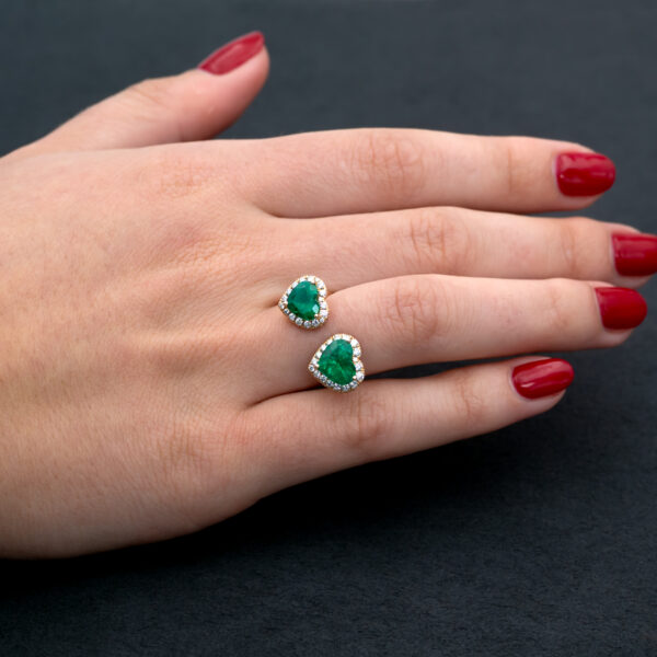 Emerald Toi et Moi Ring in Rose Gold Rose gold toi et moi ring with two heart-shaped Colombian emeralds and diamond halo settings