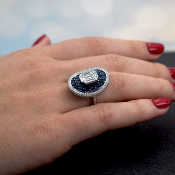 Sapphire Diamond Illusion Cluster Ring 18K white gold ring with illusion-set diamond cluster centre surrounded by baguette sapphires and pavé diamonds