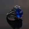 Tanzanite Cabochon Sculptural Ring tanzanite cabochon and sapphire ring in white gold with sculptural curved design