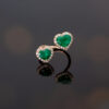 Emerald Toi et Moi Ring in Rose Gold Rose gold toi et moi ring with two heart-shaped Colombian emeralds and diamond halo settings