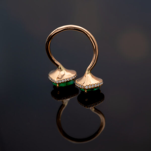 Emerald Toi et Moi Ring in Rose Gold Rose gold toi et moi ring with two heart-shaped Colombian emeralds and diamond halo settings