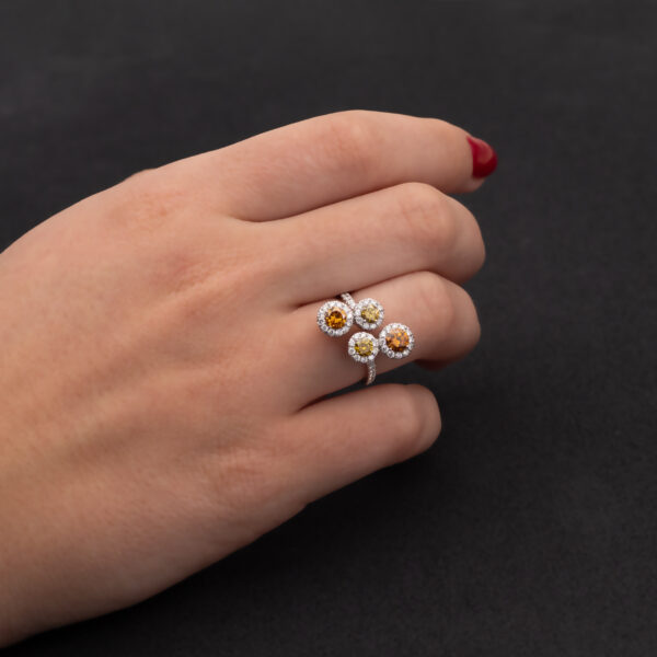 Fancy Colour Diamond Cluster Ring 18K white gold ring with four circular clusters of fancy colour diamonds surrounded by pavé-set white diamonds